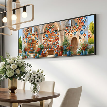 a large, colorful painting of a building with a courtyard, hanging on a wall above a dining table with a vase of flowers.