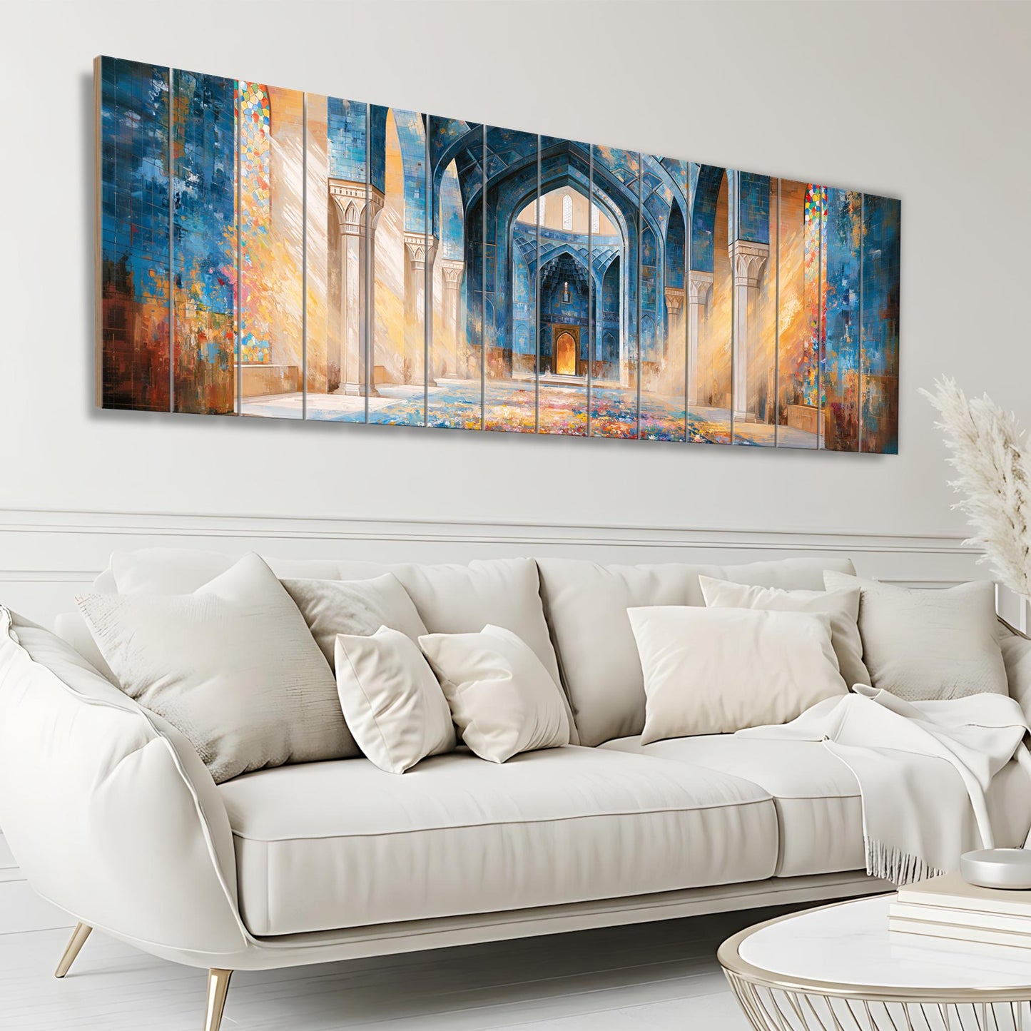 a large, colorful painting of an ornate, blue-colored archway or doorway, which is displayed on a wall above a white sofa in a living room setting.