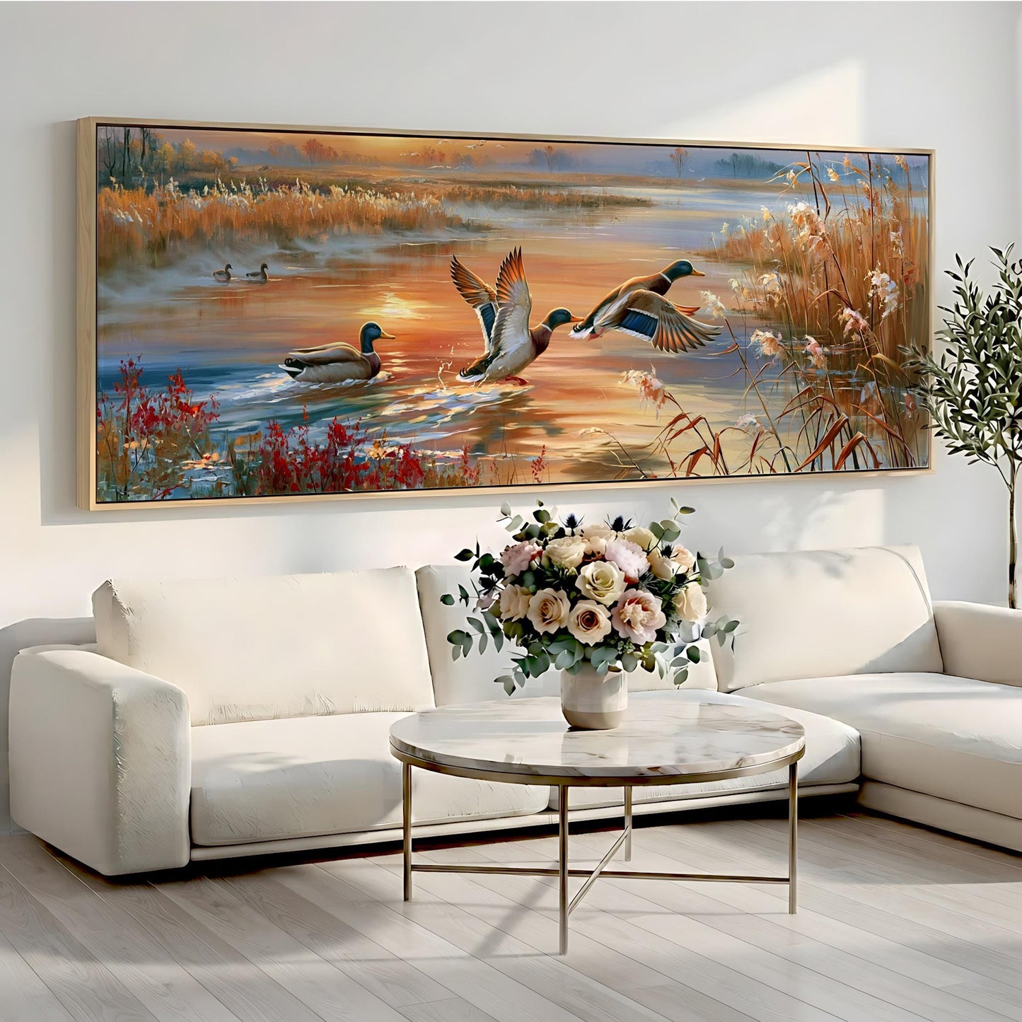 a large painting of ducks swimming in a pond, with a vase of flowers on a table in front of it.