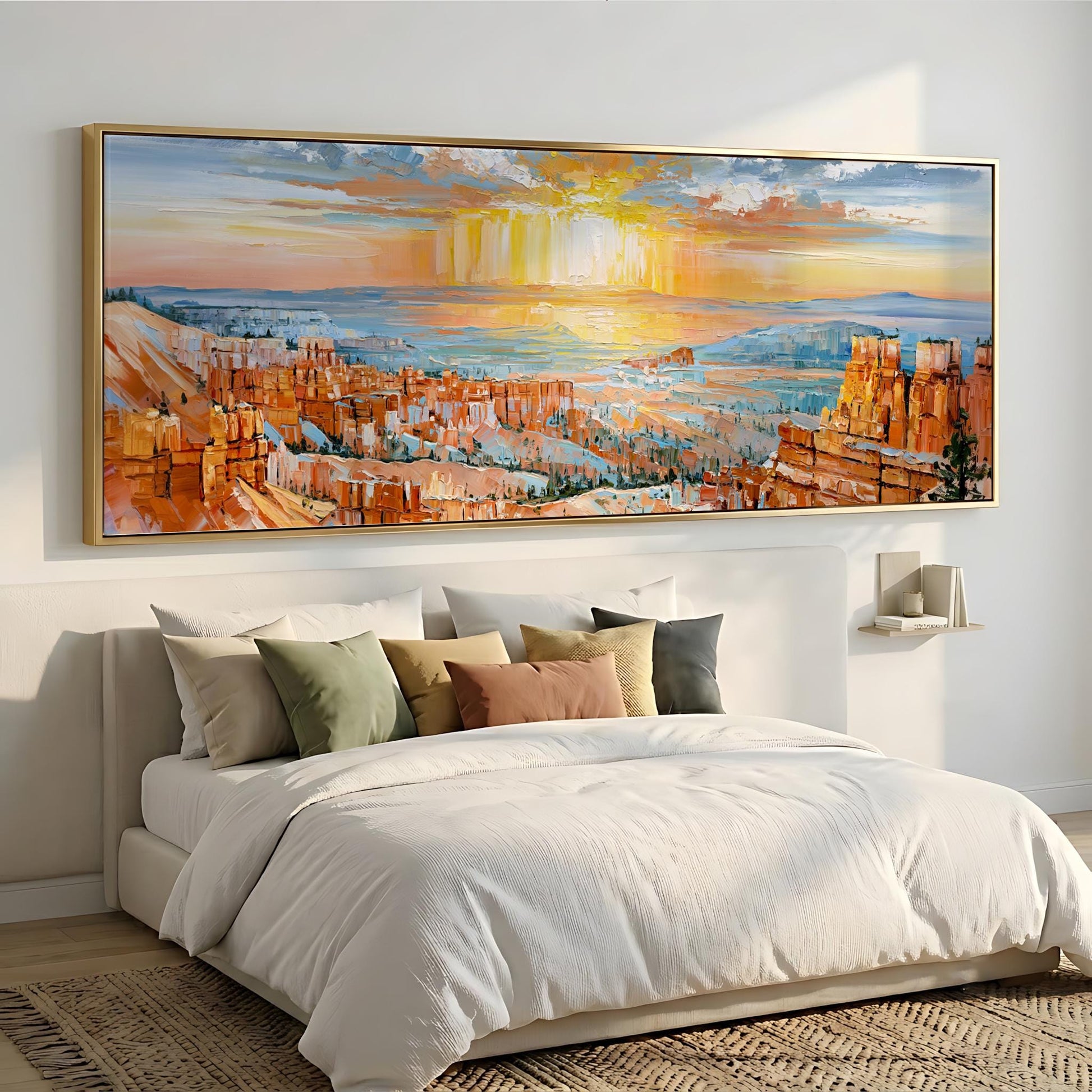 a large, colorful painting of a desert landscape hanging on a wall above a bed with white bedding.