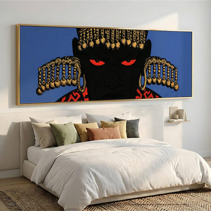 a large, colorful painting of a person's face with a striking red eye and a black background, hanging on a wall above a bed with white bedding.
