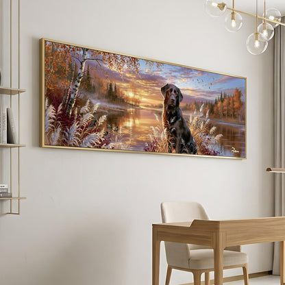 A large framed painting depicting a dog sitting in a forest landscape with a sunset in the background.