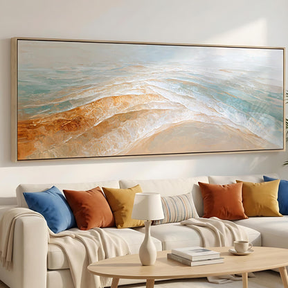 a large, colorful painting of a beach scene hanging on a wall above a white sofa with colorful throw pillows.