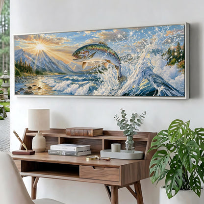 a large painting of a fish leaping out of the water, set against a backdrop of a mountain landscape with a sunset. The painting is hung on a wall above a wooden desk with various items on it, including a lamp, books, and a plant.