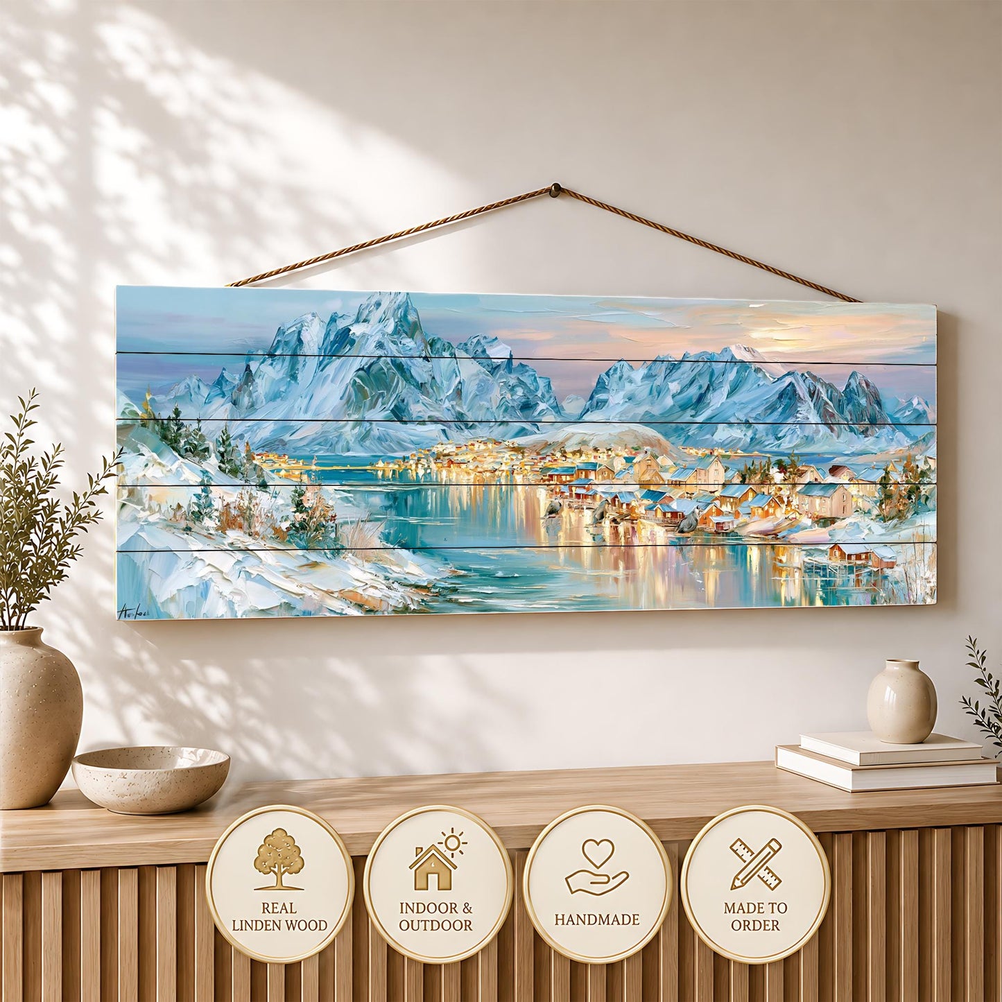 a large wooden panel hanging on a wall, depicting a snowy mountain landscape with a village in the distance. The panel is made of real wood and is displayed on a wooden shelf.