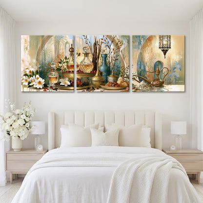 The image is a large, three-panel painting displayed on a white wall above a bed with white bedding. The paintings depict various decorative items, including vases, flowers, and other ornamental objects, arranged in a harmonious and visually appealing manner.