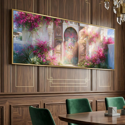 a large, ornate painting of a garden with pink flowers and a fountain, hanging on a wooden wall above a dining table with green chairs.