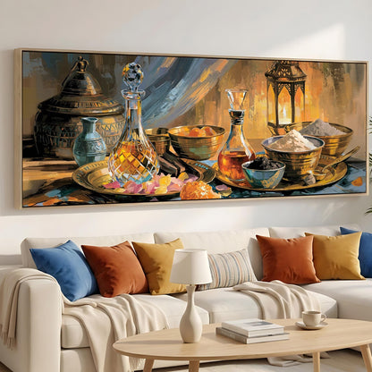 a cozy living room with a large painting of various objects, including a vase, bowls, and a lamp, hanging on the wall above a white sofa adorned with colorful throw pillows.