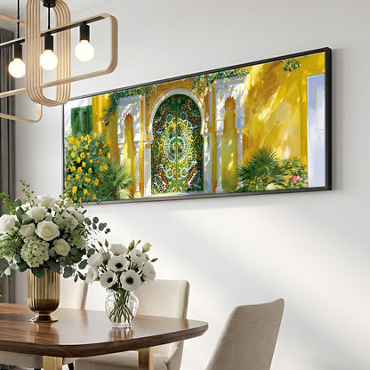 a dining room with a large, colorful painting of a yellow and green gate hanging on the wall above a wooden table. The table is set with a vase of white flowers and a potted plant, creating a warm and inviting atmosphere.