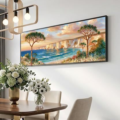 a large painting of a scenic landscape with a body of water, trees, and a sunset sky, hanging on a wall above a dining table with a vase of flowers.