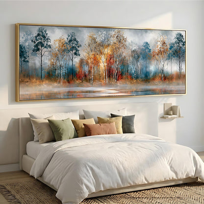 a large, framed painting of a serene landscape with trees and a body of water, hanging above a bed with white bedding and colorful throw pillows.