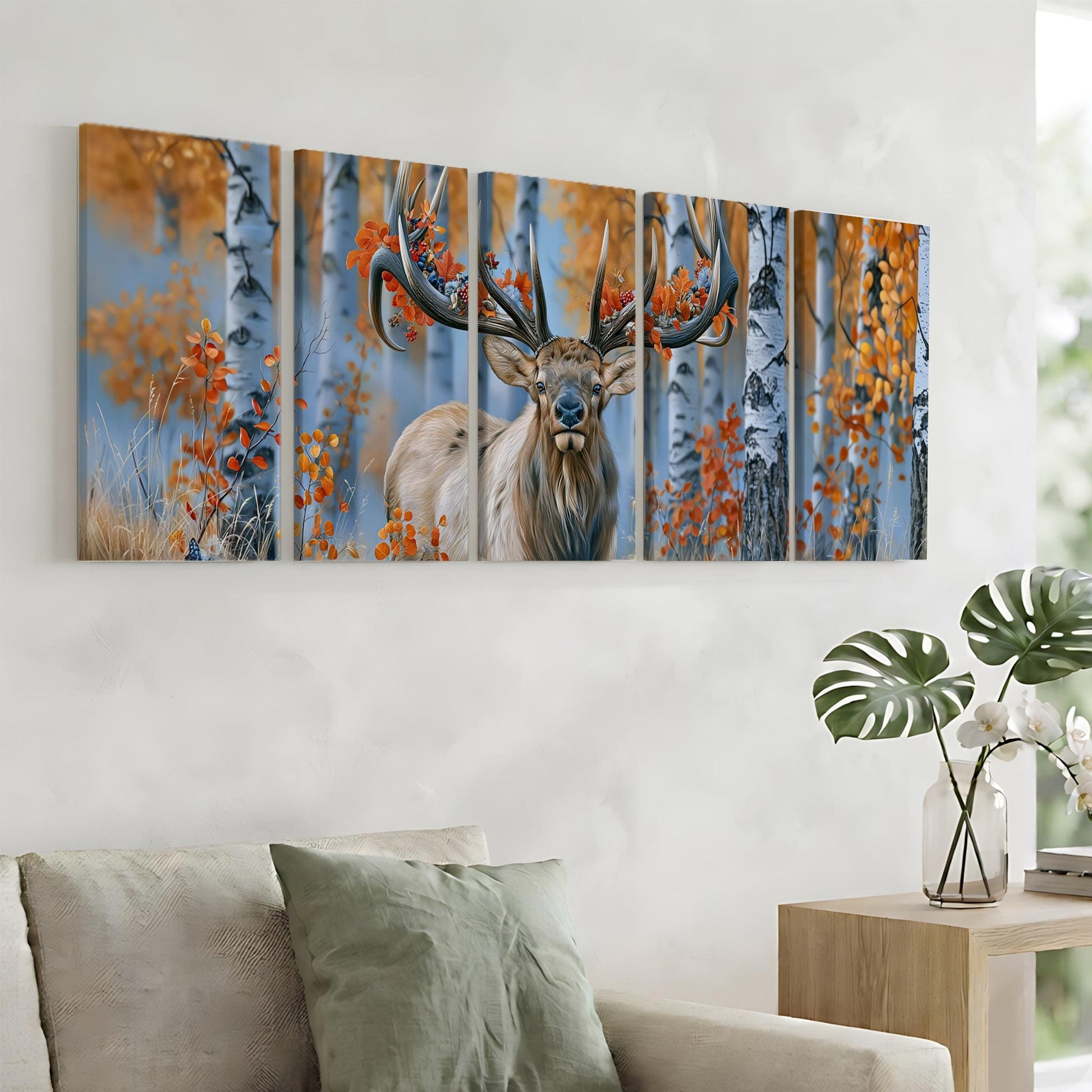 a large, colorful painting of a deer with antlers, displayed on a wall above a couch in a living room setting.