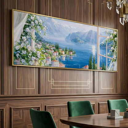 a large painting of a scenic landscape with a river, mountains, and buildings, hanging on a wooden wall above a dining table with green chairs.