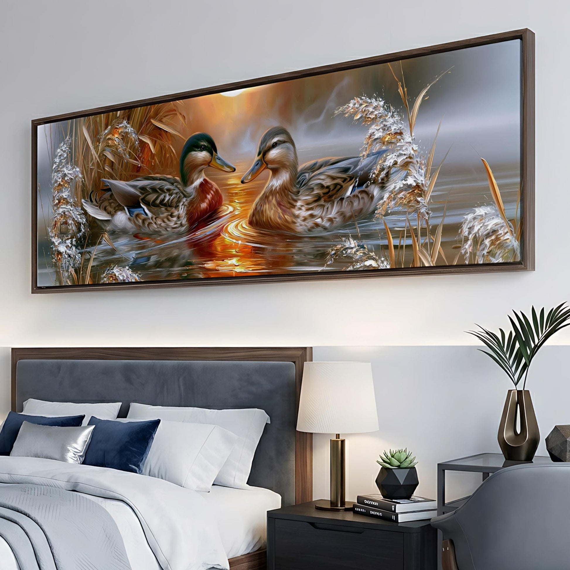 a large painting of ducks swimming in a pond, hanging on a wall above a bed in a bedroom.