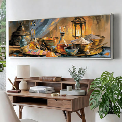 a large painting of a still life arrangement on a wall, depicting various objects such as bottles, bowls, and a lamp. The painting is hung above a wooden desk with a lamp, books, and a plant.