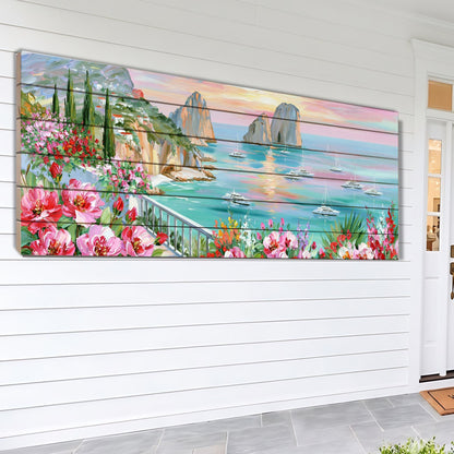 A large, colorful painting depicting a picturesque coastal scene with cliffs, flowers, and boats in the water.