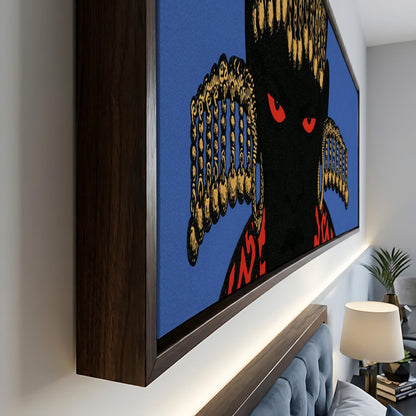 a large, framed artwork depicting a striking black figure with red eyes, set against a blue background. The artwork is displayed on a wall, and there is a lamp and a plant visible in the background.