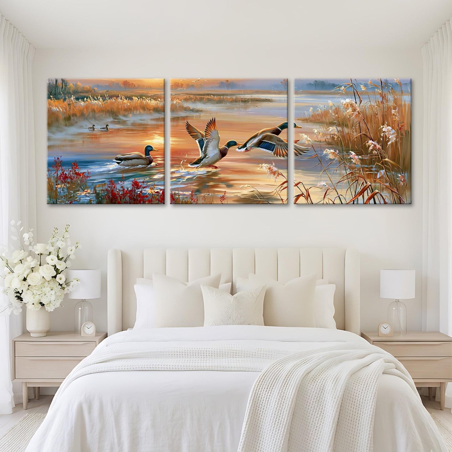 A large, three-panel painting depicting ducks swimming in a pond with a sunset in the background.