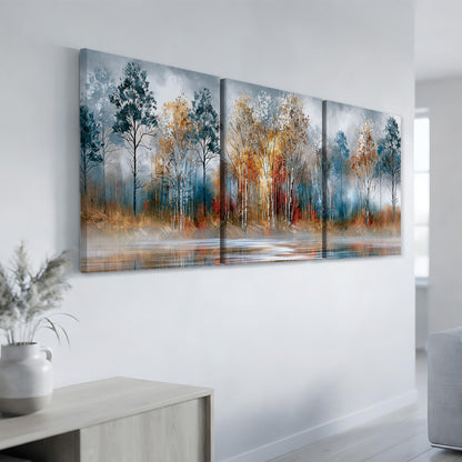 a large, three-panel landscape painting hanging on a white wall. The painting depicts a serene forest scene with trees in various shades of blue, orange, and yellow, set against a calm body of water.