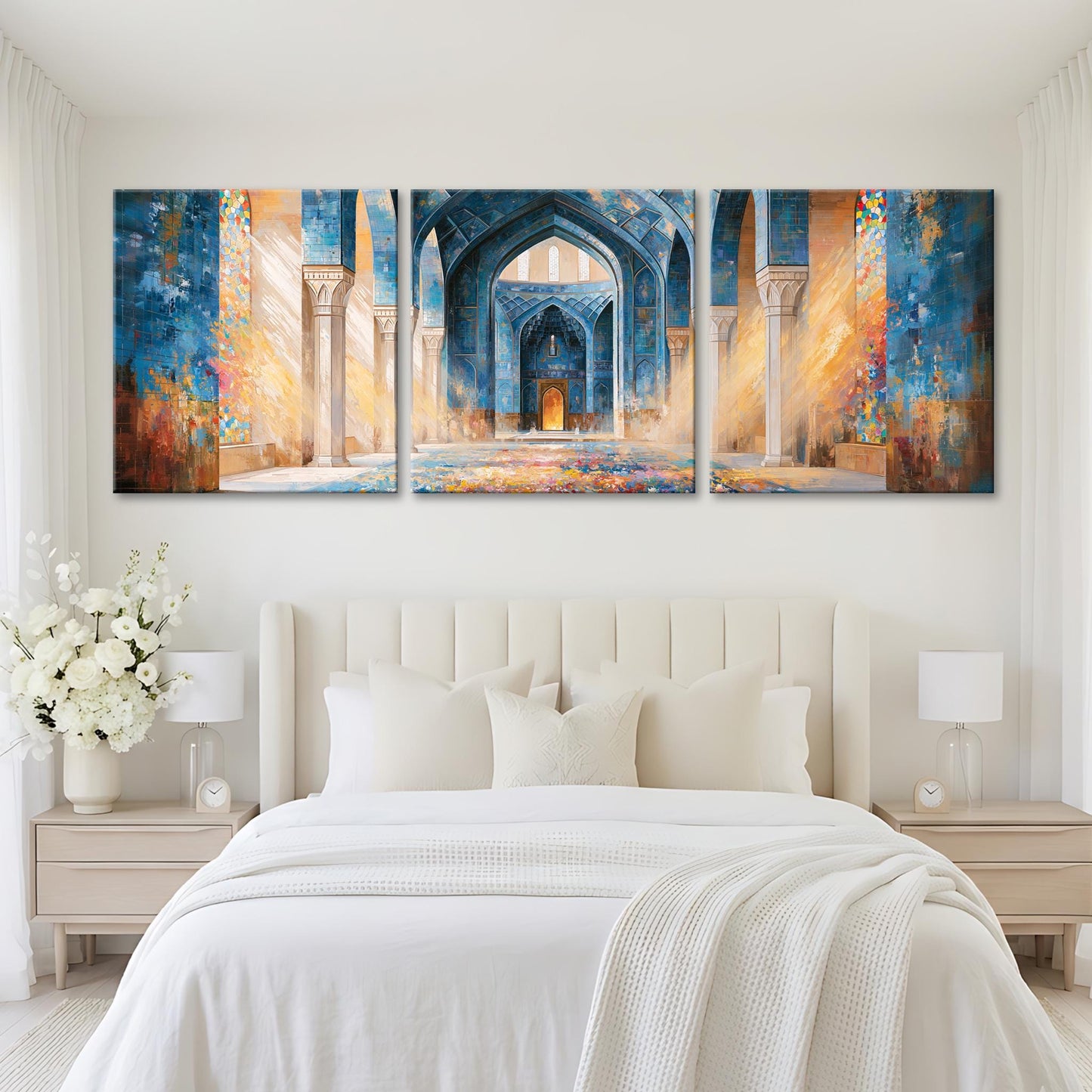 A large, three-panel painting depicting an ornate, colorful archway in a mosque, hanging above a bed with white bedding and pillows.