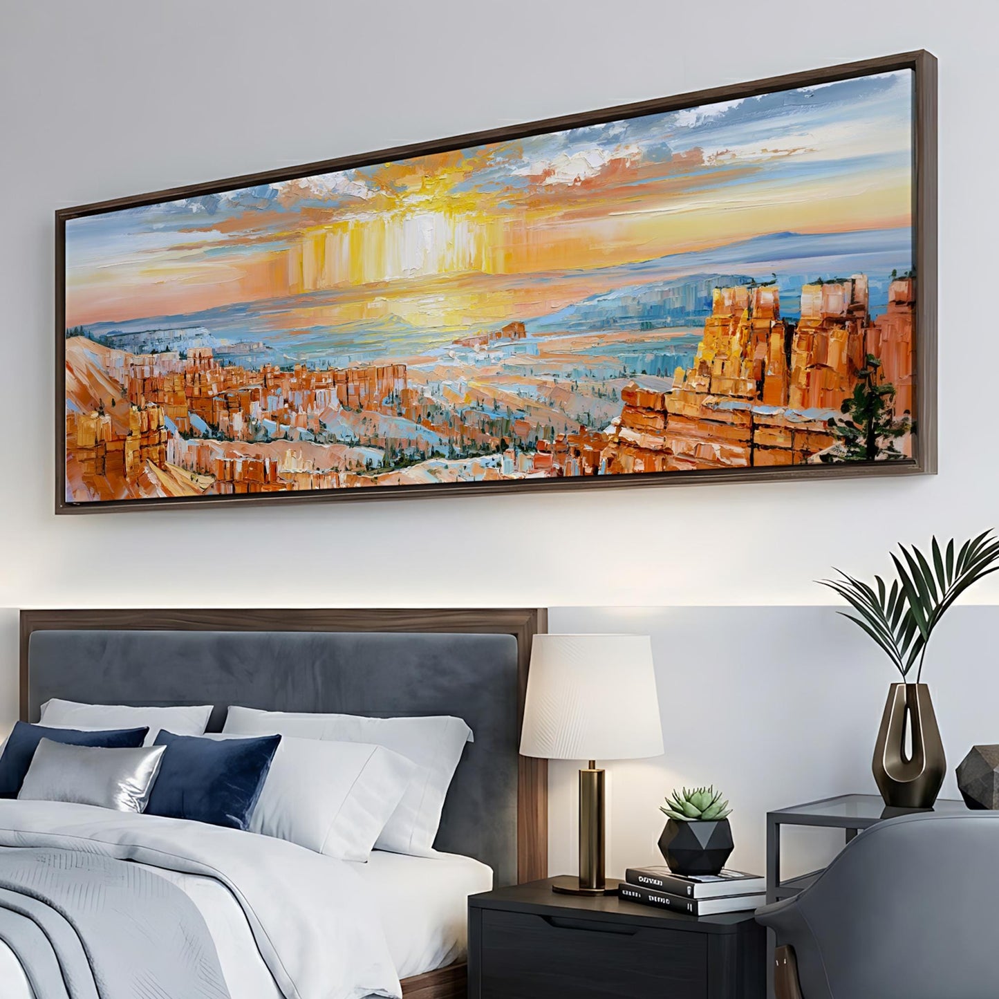 a large, colorful painting of a desert landscape hanging on a wall above a bed with white linens and a wooden headboard.