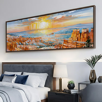 a large, colorful painting of a desert landscape hanging on a wall above a bed with white linens and a wooden headboard.