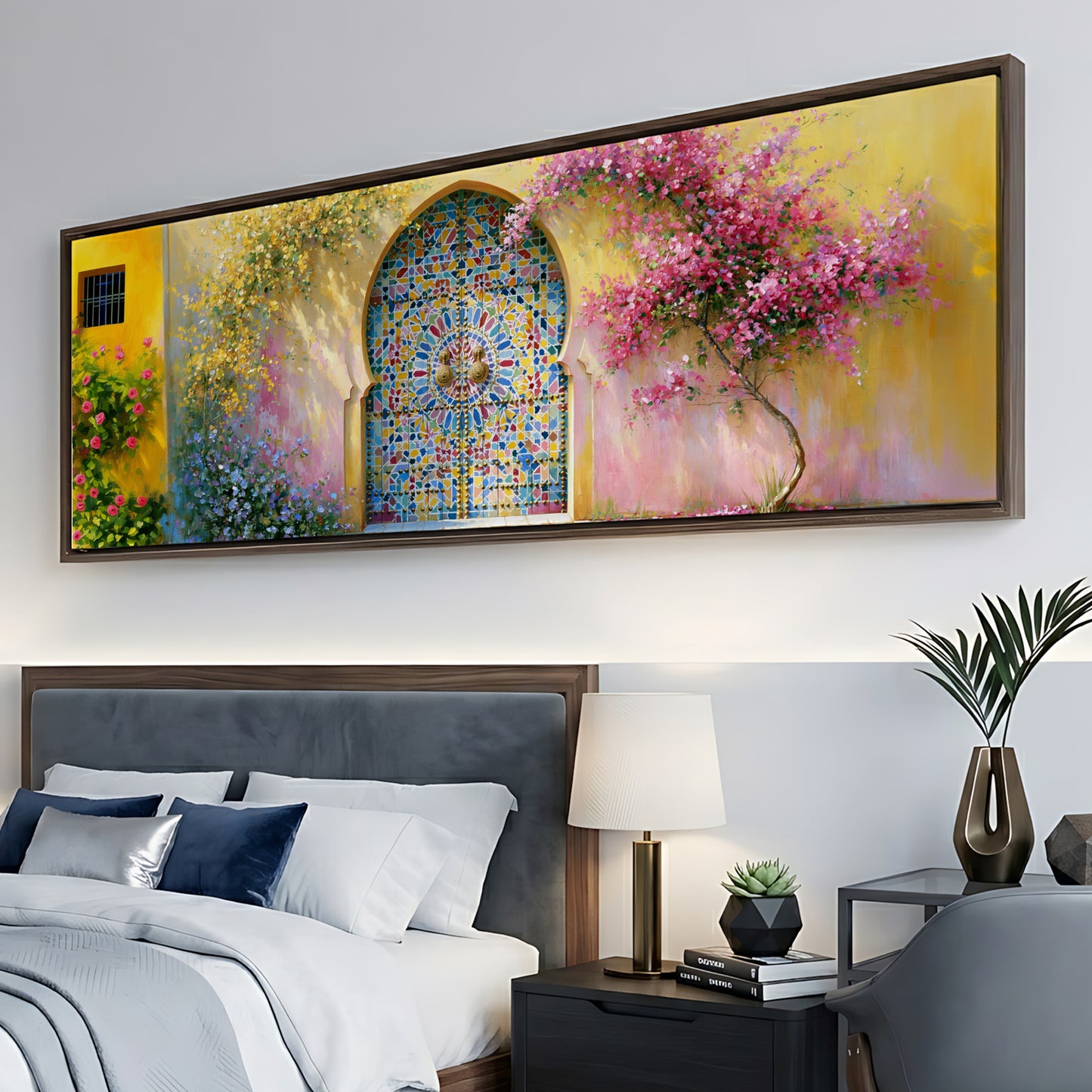 a large, colorful painting of a garden scene hanging on a wall above a bed with white linens and blue pillows.