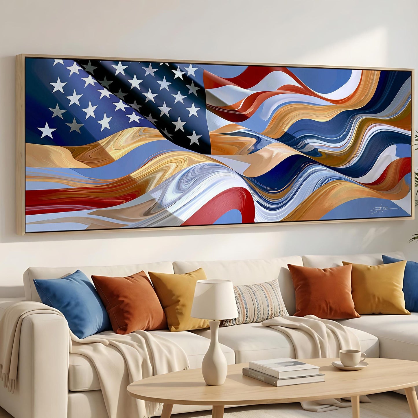a large, colorful abstract painting of the American flag hanging on a wall above a white couch with colorful throw pillows.