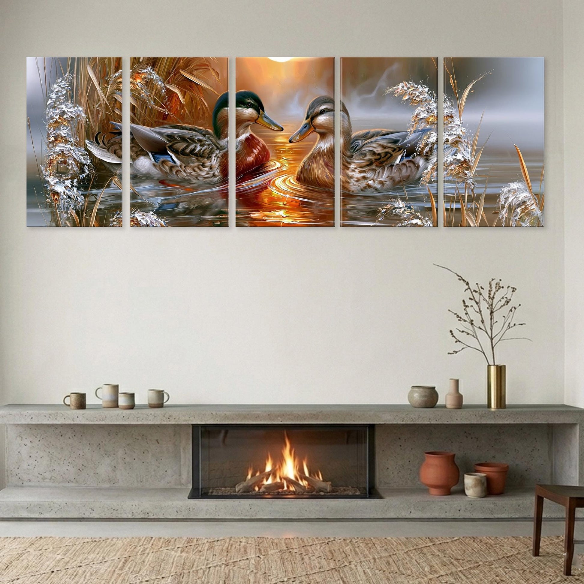 A cozy living room with a fireplace, a coffee table, and a vase of flowers. Above the fireplace, there is a large painting depicting two ducks swimming in a pond, with a warm, golden sunset in the background.