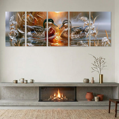 A cozy living room with a fireplace, a coffee table, and a vase of flowers. Above the fireplace, there is a large painting depicting two ducks swimming in a pond, with a warm, golden sunset in the background.