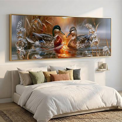 a large painting of two ducks swimming in a pond, hanging on a wall above a bed with white bedding.