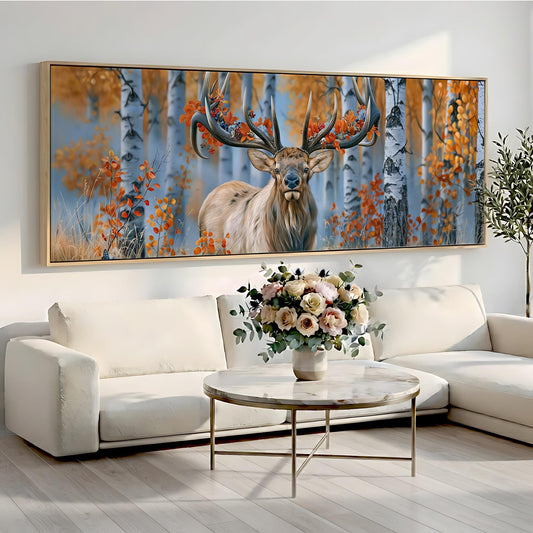 a large painting of a deer with antlers, displayed on a wall above a white sofa and a round coffee table with a vase of flowers.