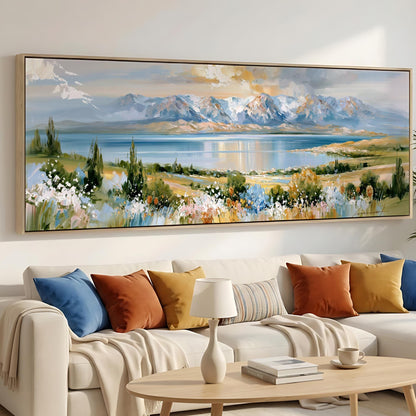 a large landscape painting hanging on a wall above a white sofa with colorful throw pillows.