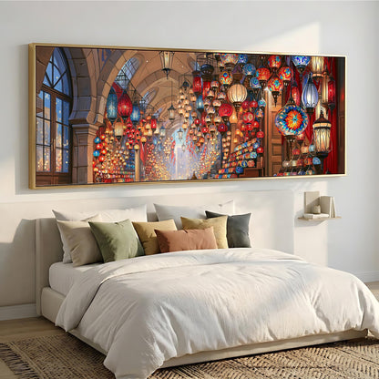 a large, colorful painting of a lantern-filled room hanging on a wall above a bed with white bedding.