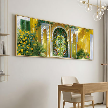 a large, colorful painting of a building with a green door and yellow walls, hanging on a white wall above a wooden desk and chair in a modern, minimalist room.