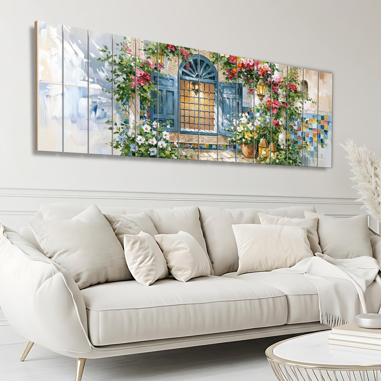 a large, colorful painting of a window with flowers and plants adorning the wall above a white sofa in a living room setting.