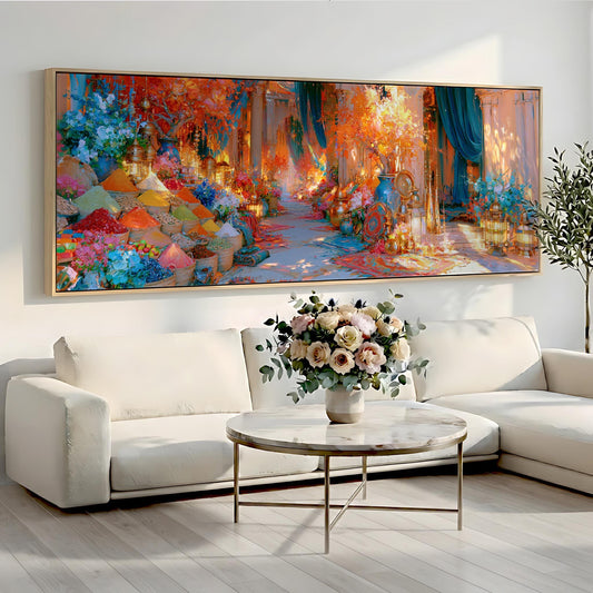 a large, colorful painting of a garden hanging on a wall above a white sofa and a round coffee table with a vase of flowers.