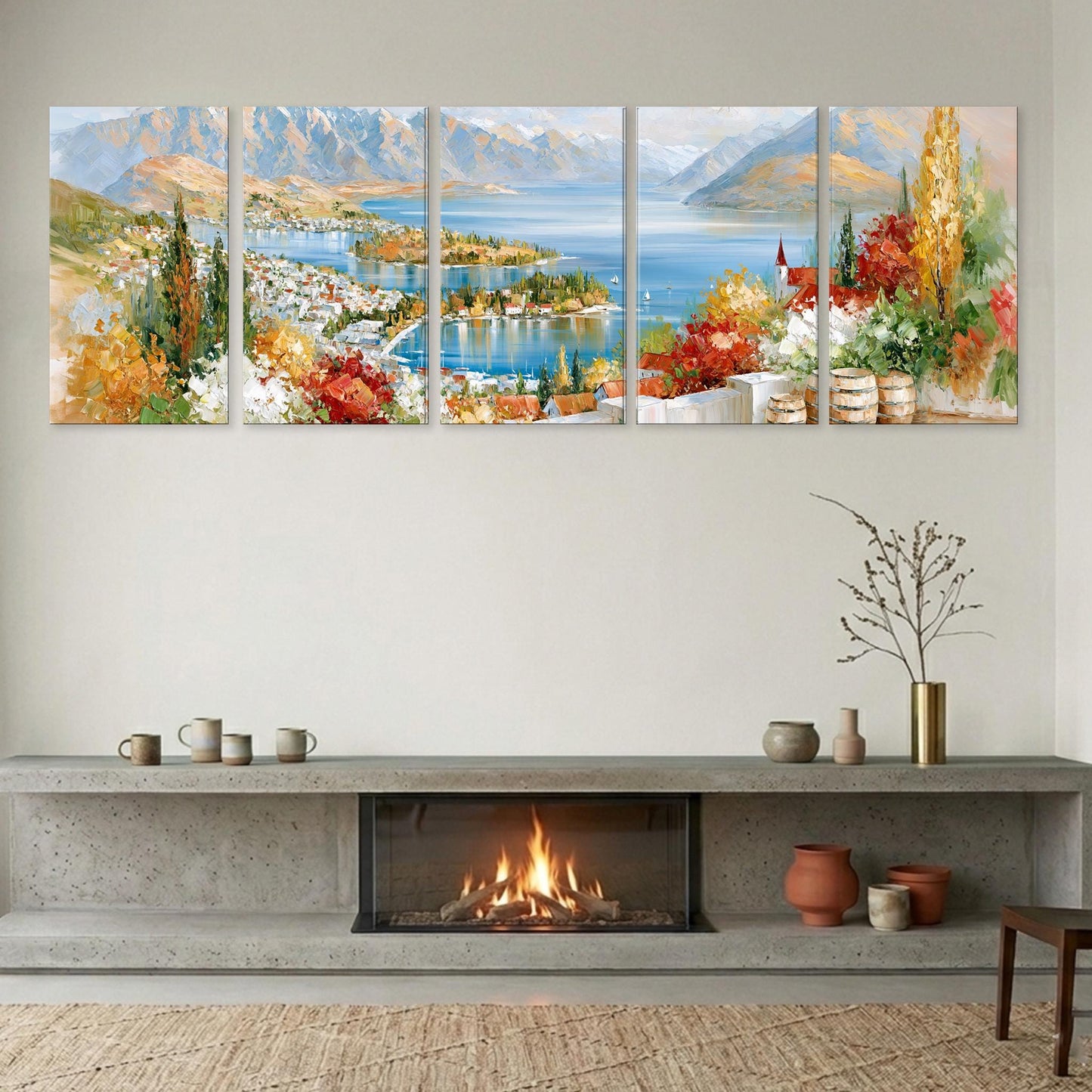 a cozy living room with a fireplace, a large wall art depicting a scenic landscape, and various decorative items on a shelf below the fireplace.