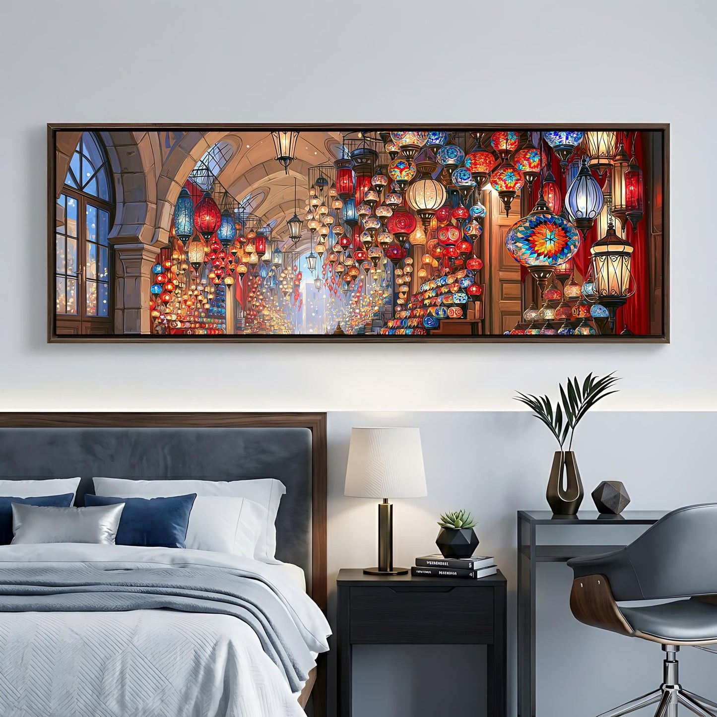 a bedroom with a large, colorful painting hanging on the wall above a bed. The painting features a variety of lanterns and lights, creating a warm and inviting atmosphere. The room also includes a nightstand, a lamp, and a chair, contributing to the overall cozy and stylish ambiance.