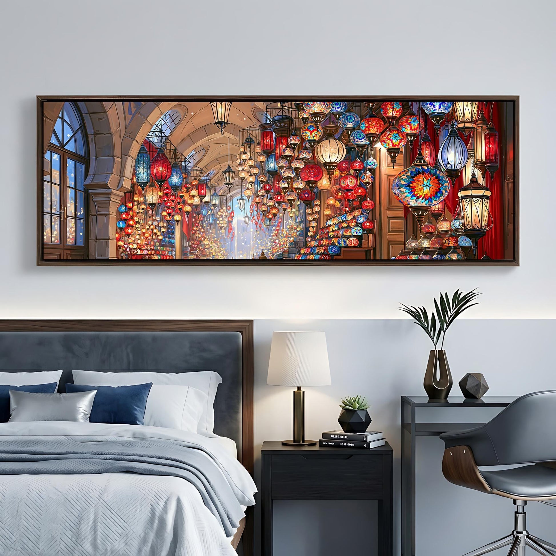 a bedroom with a large, colorful painting hanging on the wall above a bed. The painting features a variety of lanterns and lights, creating a warm and inviting atmosphere. The room also includes a nightstand, a lamp, and a chair, contributing to the overall cozy and stylish ambiance.