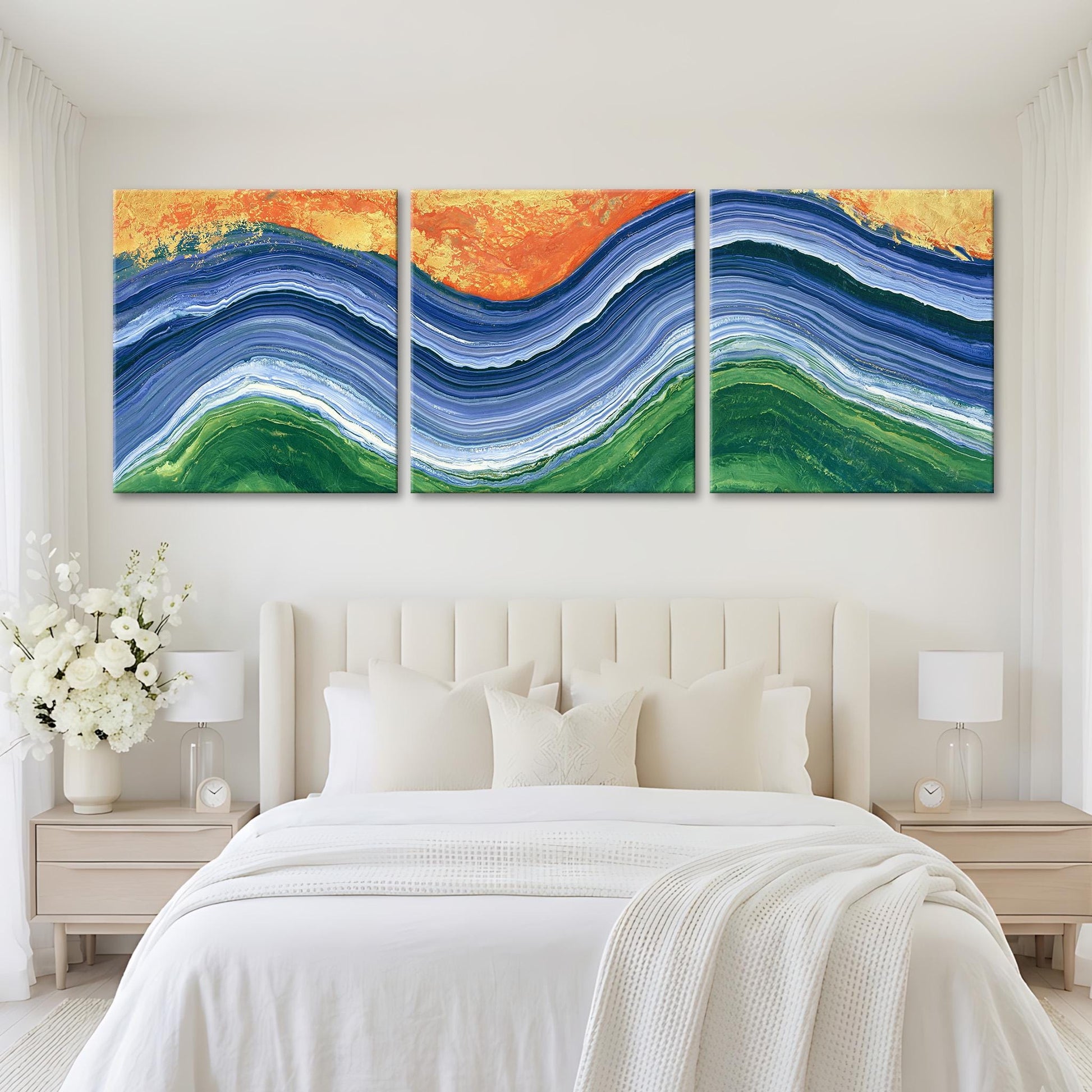 a large, white bed with a white headboard and pillows, and a large, colorful abstract painting hanging above it.