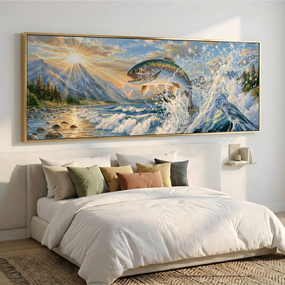 a large, framed painting of a fish leaping out of the water, set against a backdrop of mountains and a sunset.