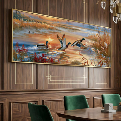 a large painting of ducks in a pond, hanging on a wooden wall above a dining table with green chairs.