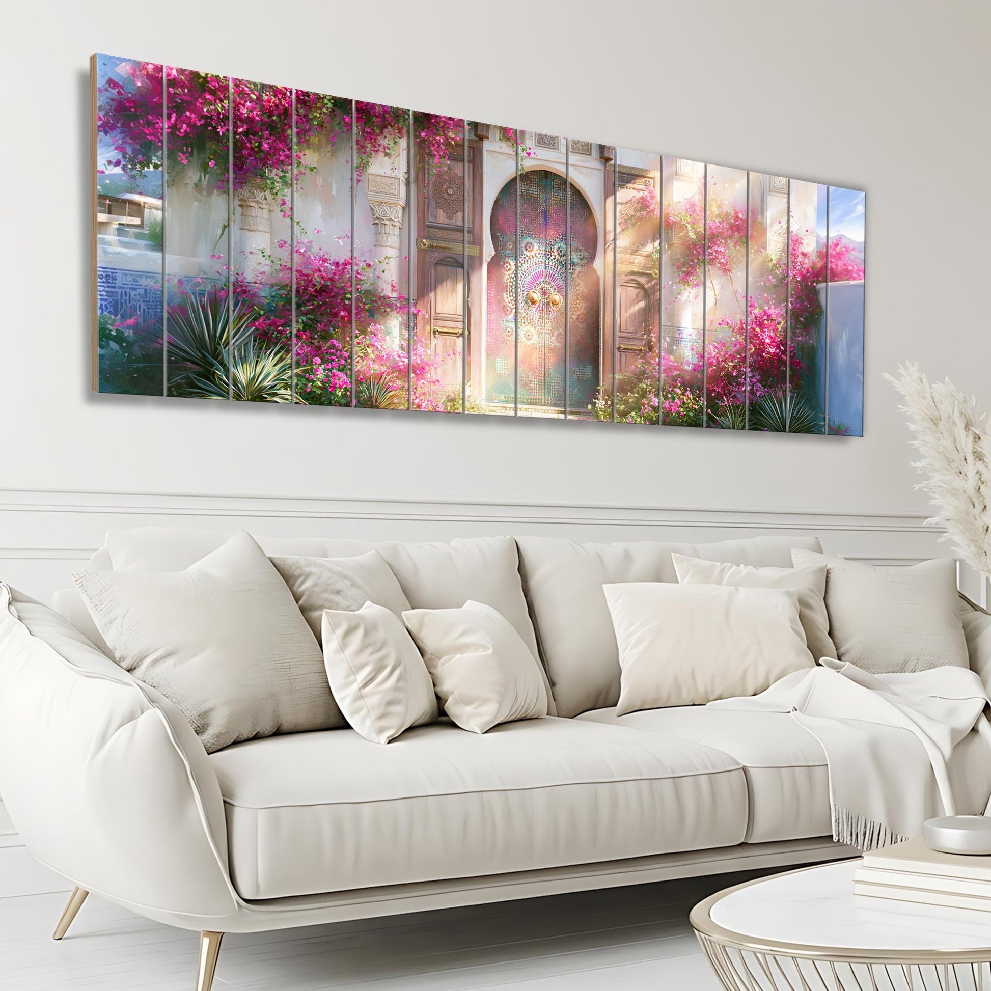A large, white, plush couch sits in a modern living room, with a colorful, floral-patterned wall hanging above it.