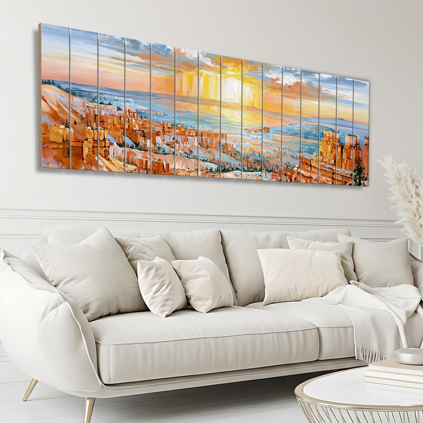 a large, colorful painting of a cityscape with a sunset in the background, hanging on a wall above a white sofa in a living room setting.