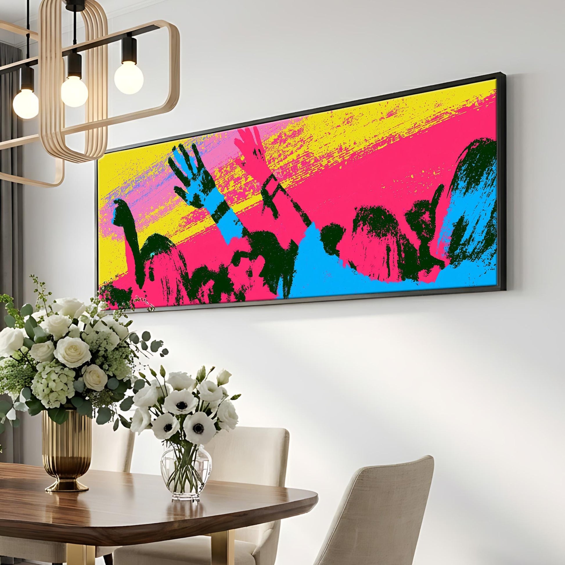 a modern dining room with a large, colorful abstract painting hanging on the wall above a wooden table. The table is set with a vase of white flowers, and there are two chairs positioned around it. The overall decor has a contemporary and vibrant feel.