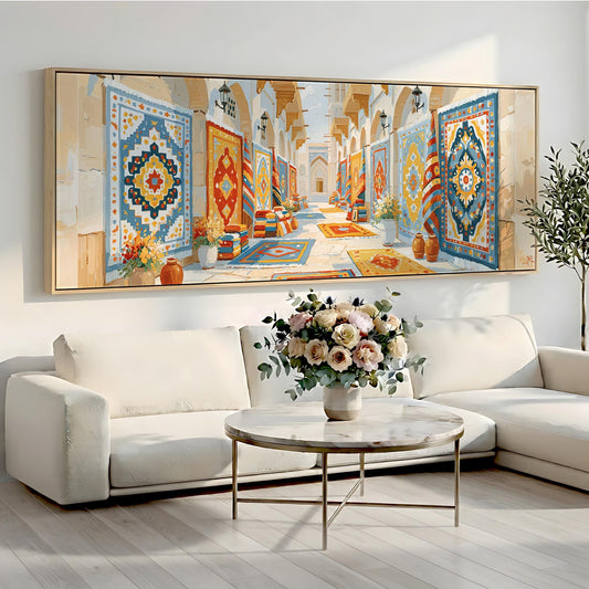 a large, colorful painting of a hallway with intricate patterns and designs hanging on the wall above a white sofa and a round coffee table with a vase of flowers.