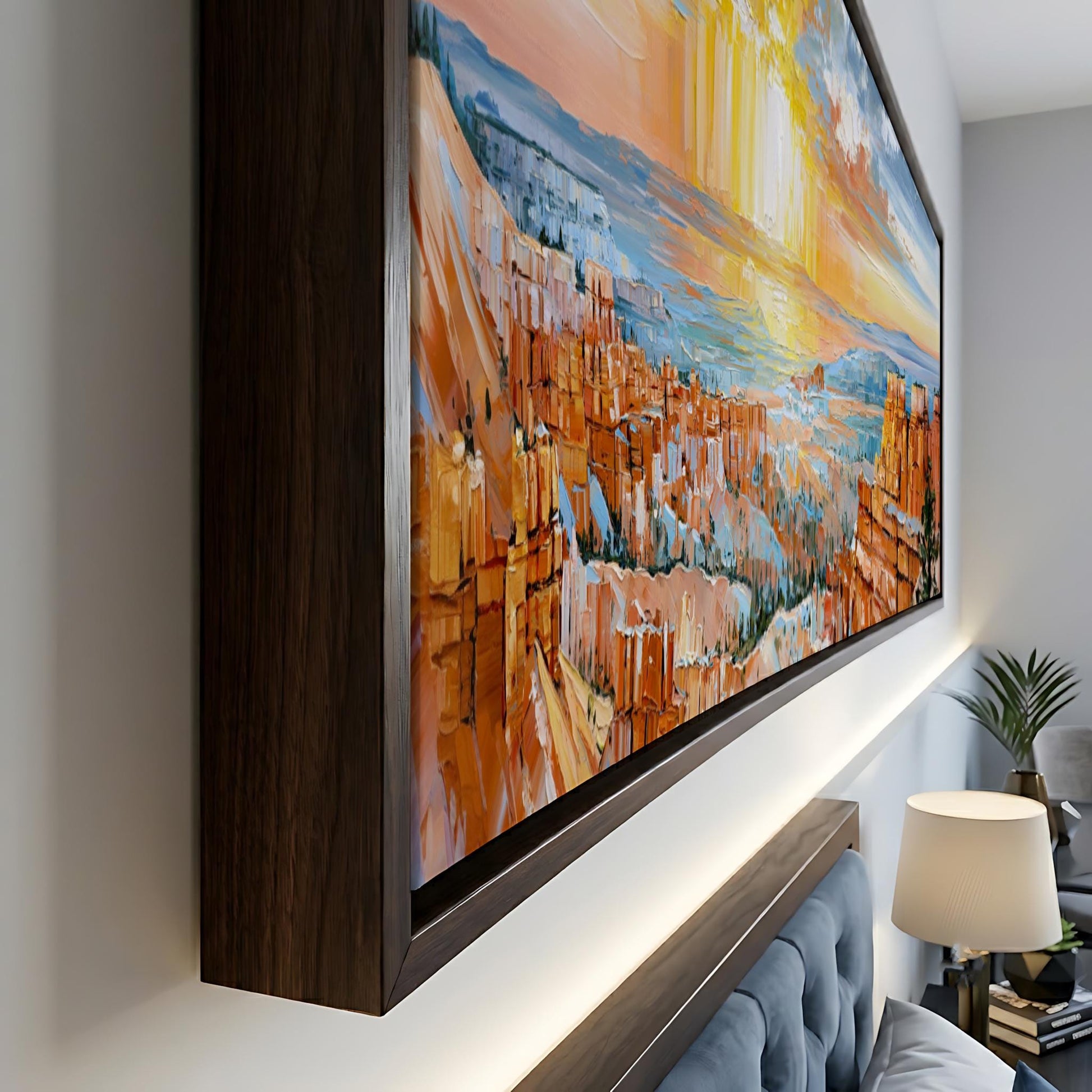 a large, colorful painting of a mountainous landscape, hanging on a wall in a room.