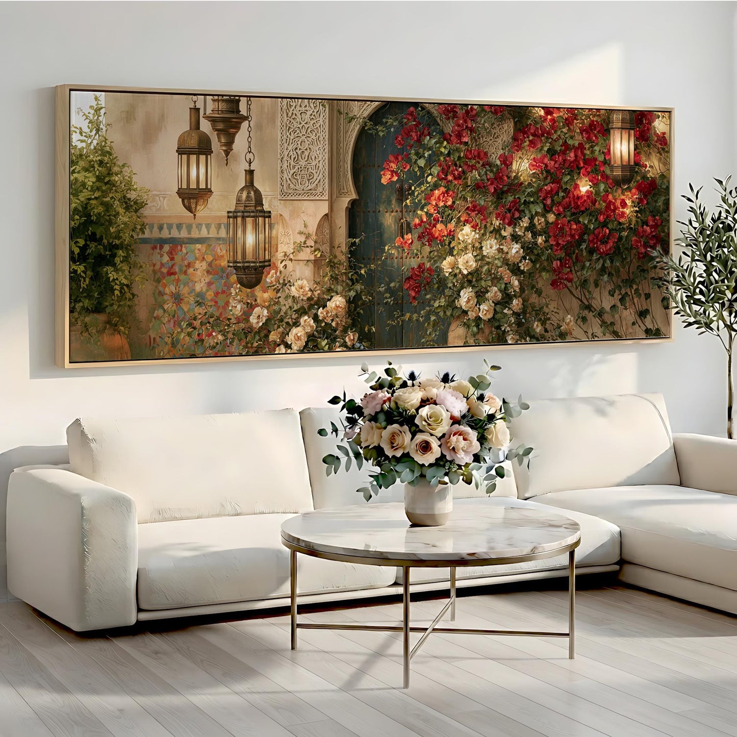 a large, ornate painting of a garden scene with hanging lanterns and a vase of flowers on a white sofa in a living room setting.
