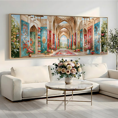 a large, colorful painting of an ornate hallway with arches and columns, hanging on a wall above a white sofa and a round coffee table with a vase of flowers.